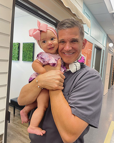Dr. Collins with pediatric patient at Smiles of Dripping Springs in Texas